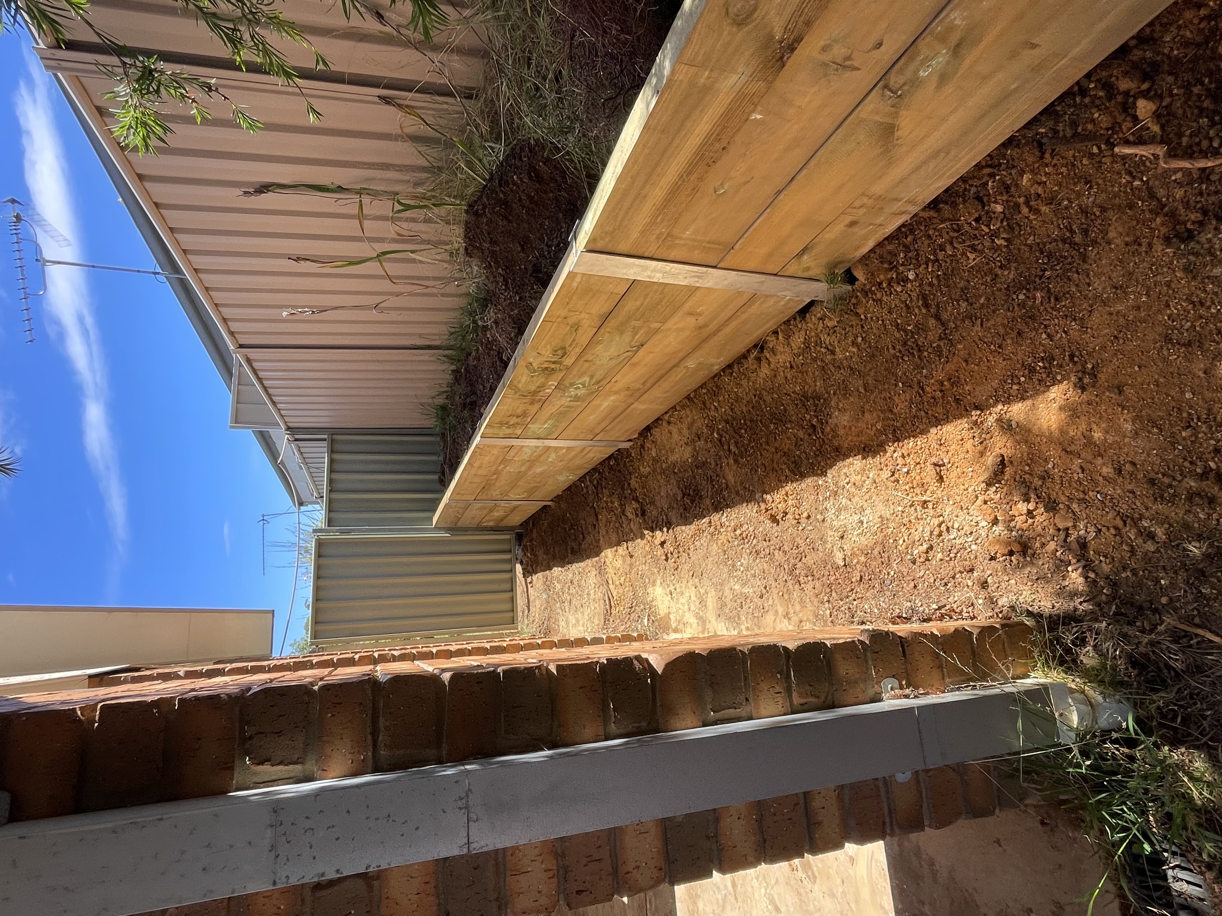 Timber retaining wall and garden bed