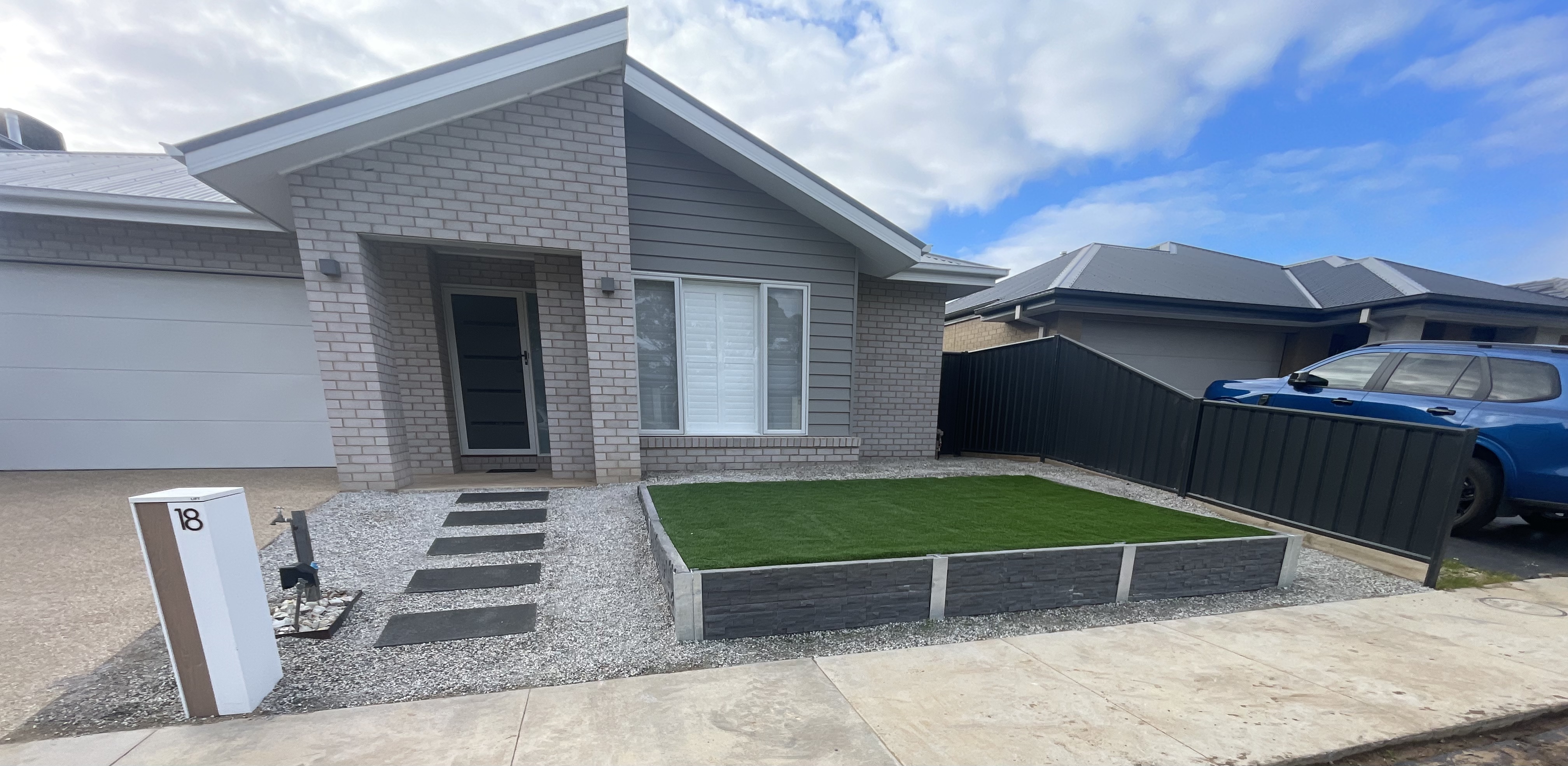 Completed front yard with turf and gravel